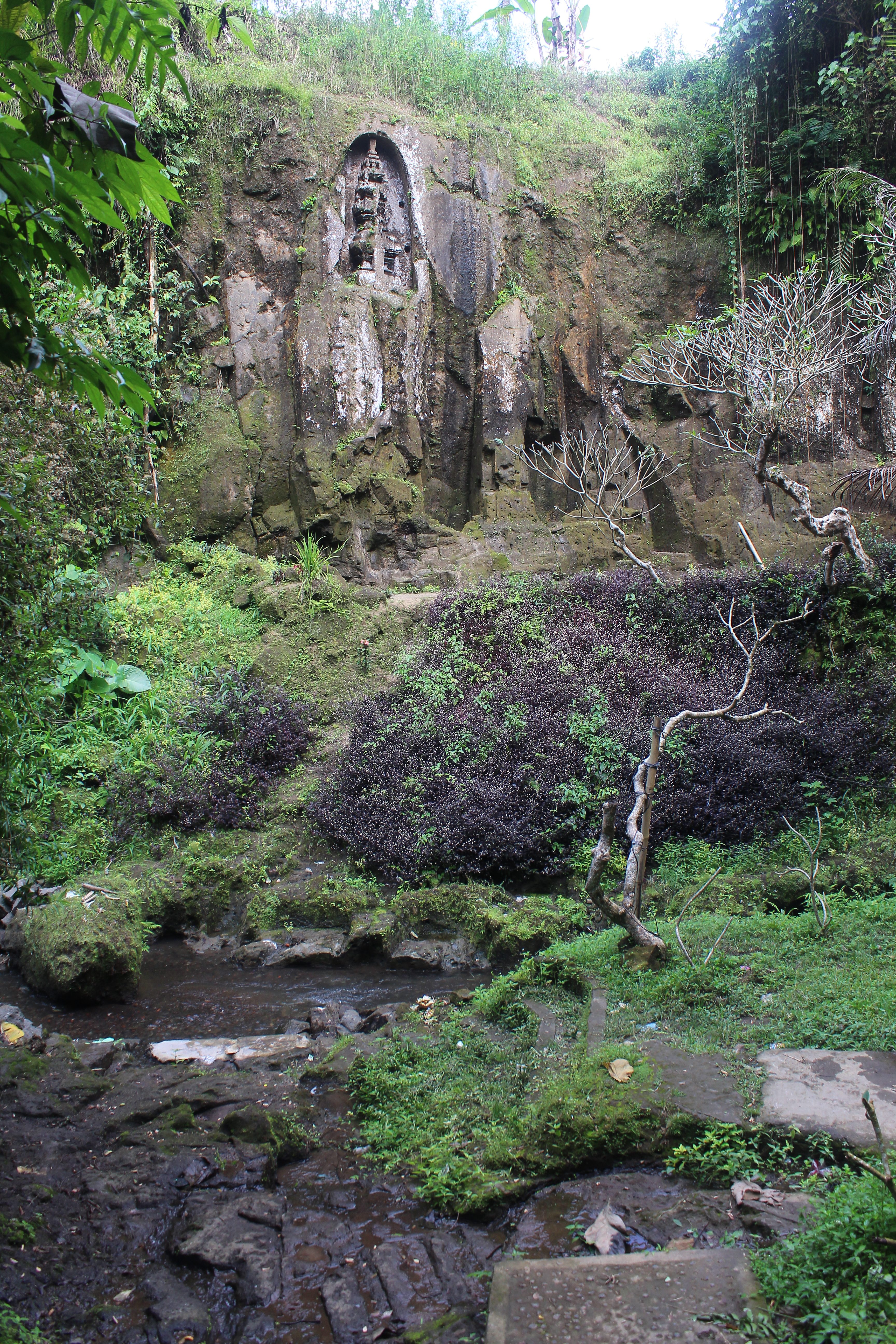 Small rock-cut shrine in the river ravine seen from below